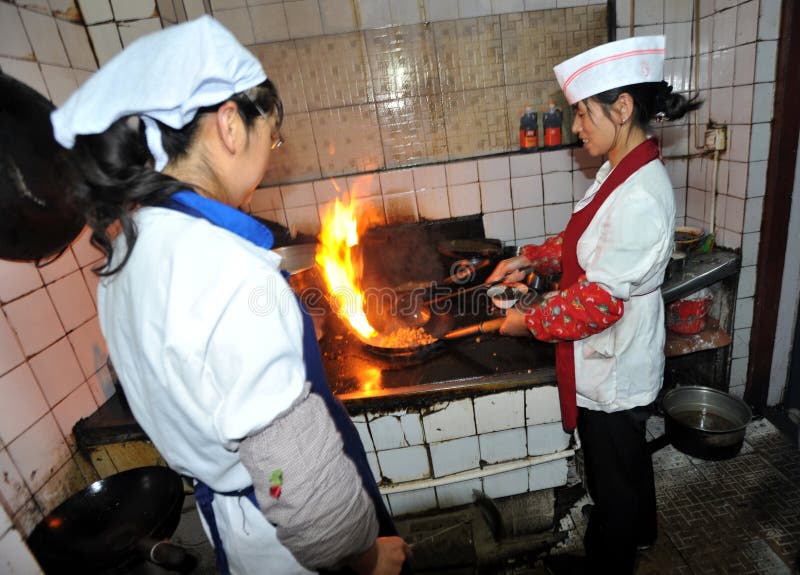 Cook making a dinner in local restaurant in Xining, western China. Cook making a dinner in local restaurant in Xining, western China