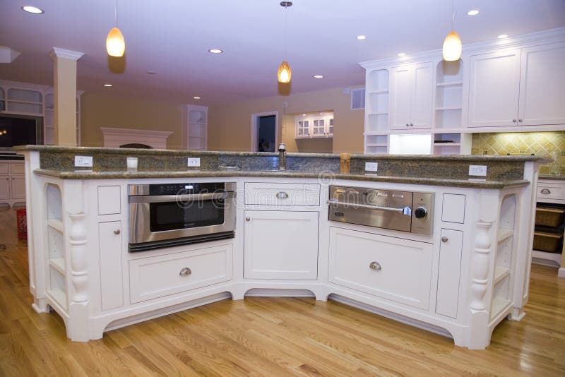 Shot of a recently remodeled luxurious modern kitchen featuring stainless steel appliances. Shot of a recently remodeled luxurious modern kitchen featuring stainless steel appliances.