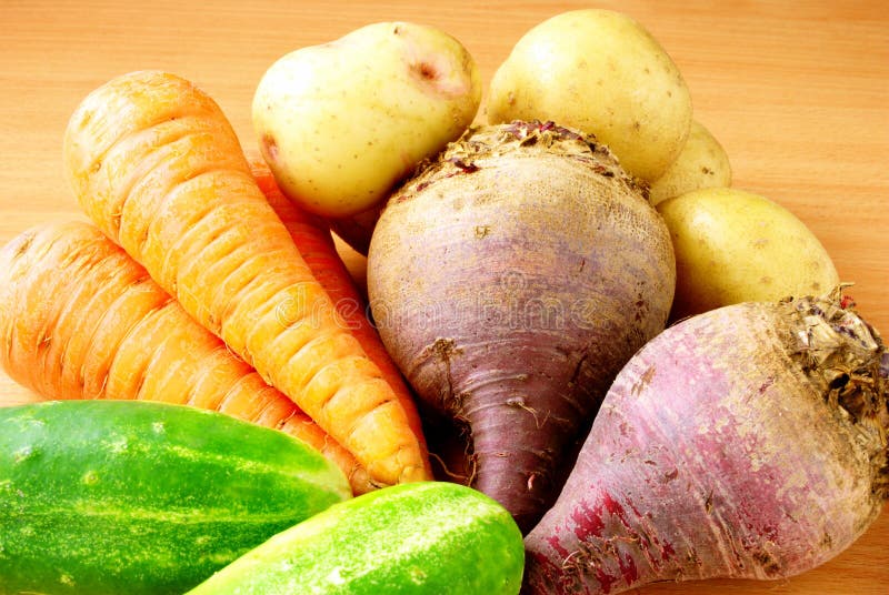 Cucumber, carrots, beets, potatoes on the table