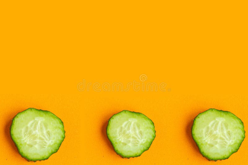 Cucumber pattern on bright orange background, minimal concept, copy space for the text