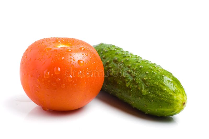 Cucumber and tomato on a white background