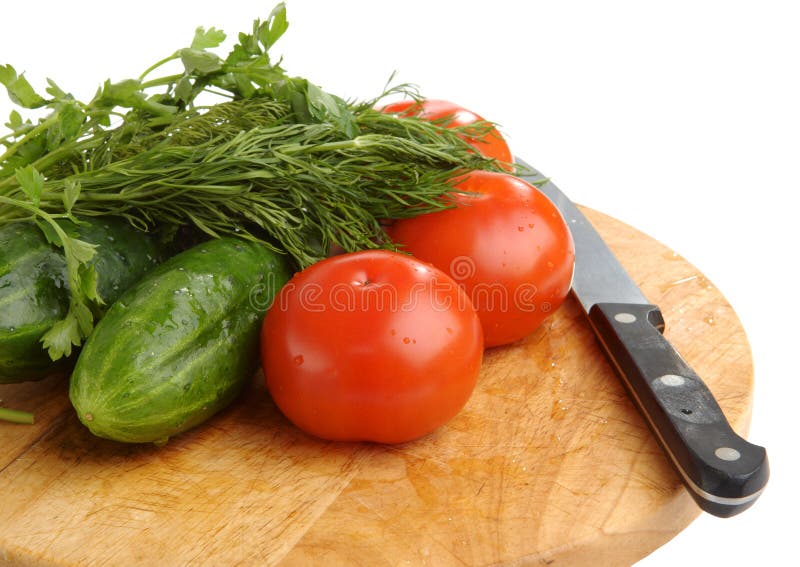 The cucumbers, tomatoes, fennel and knife