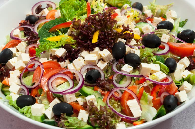 A huge bowl of greek salad. A huge bowl of greek salad