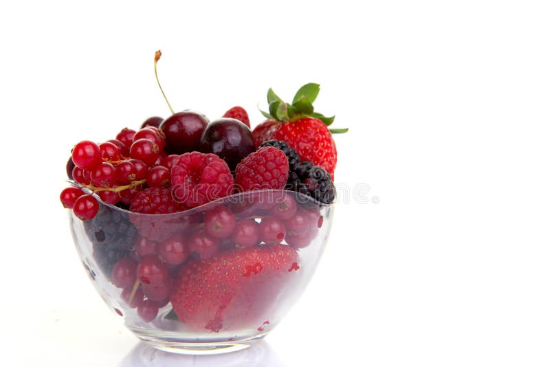 Bowl of ripe red summer fruits or berries. Bowl of ripe red summer fruits or berries.