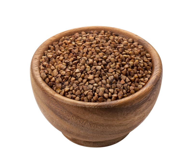 Cuenco de madera de Brown con el grano crudo seco del alforfón imágenes de archivo libres de regalías Cuenco de madera de Brown con el grano crudo seco del alforfón imágenes de archivo libres de regalías