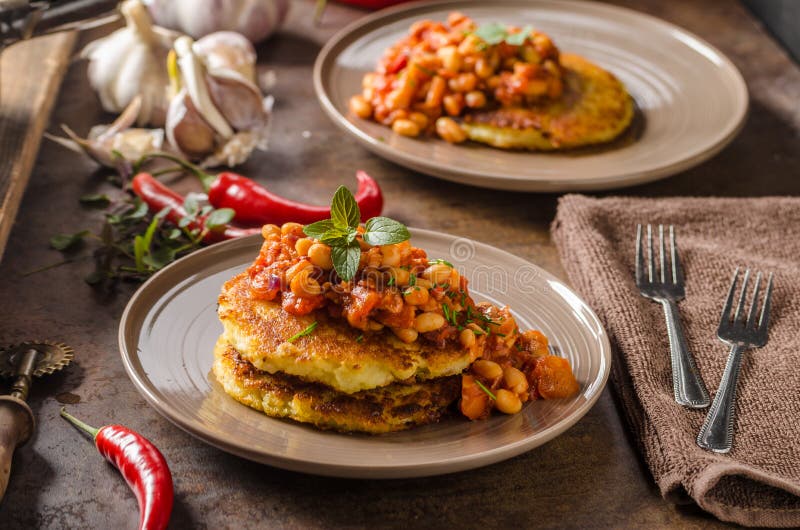 Bake beans with fluffy potato cakes, spicy and delicious breakfast. Bake beans with fluffy potato cakes, spicy and delicious breakfast