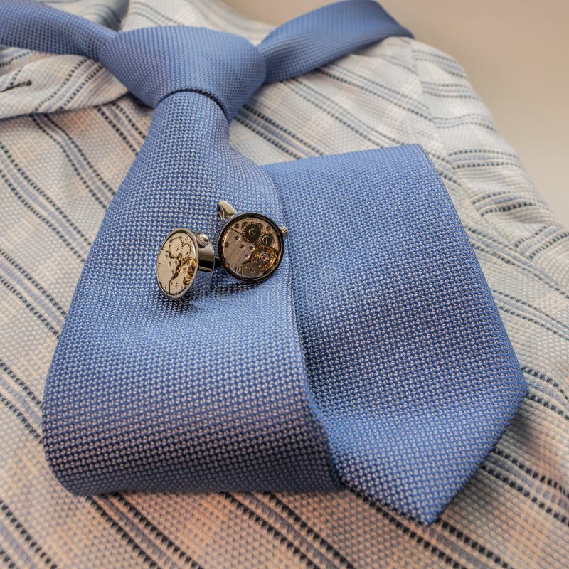 Cufflinks on blue shirt stock image. Image of shirt, light 9068945