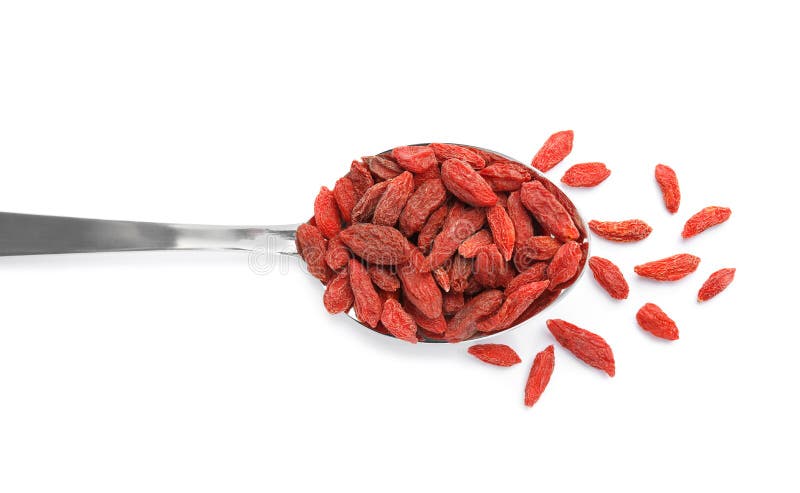 Cuillère des baies sèches savoureuses de goji sur la vue blanche et supérieure photos libres de droits Cuillère des baies sèches savoureuses de goji sur la vue blanche et supérieure photos libres de droits