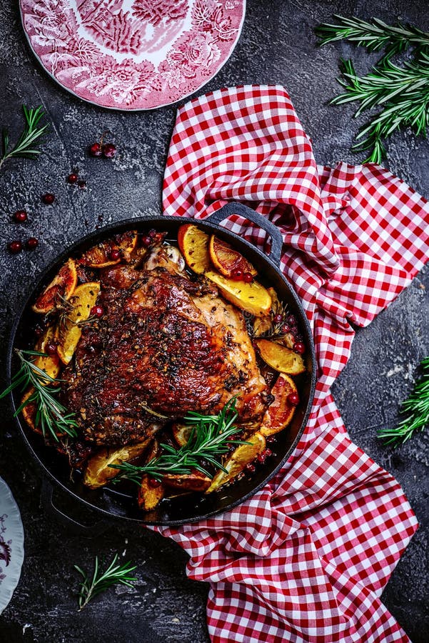 Turkey thigh baked with oranges and cranberries...style rustic.selective focus. Turkey thigh baked with oranges and cranberries...style rustic.selective focus