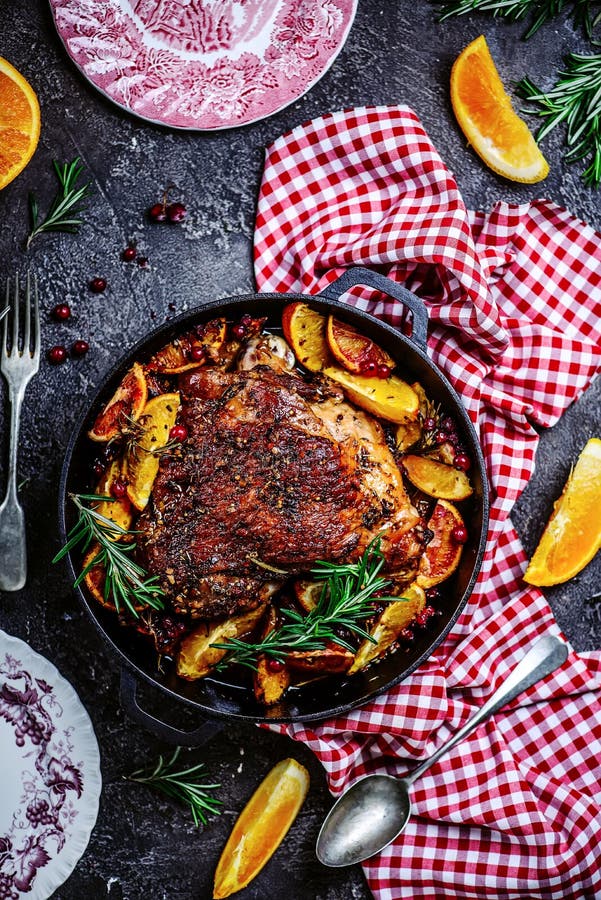 Turkey thigh baked with oranges and cranberries...style rustic.selective focus. Turkey thigh baked with oranges and cranberries...style rustic.selective focus