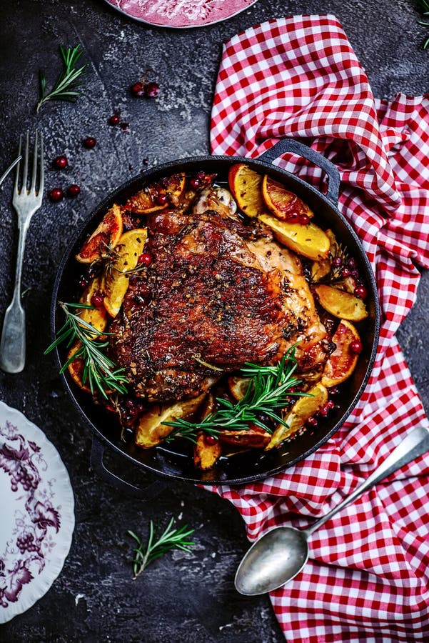 Turkey thigh baked with oranges and cranberries...style rustic.selective focus. Turkey thigh baked with oranges and cranberries...style rustic.selective focus