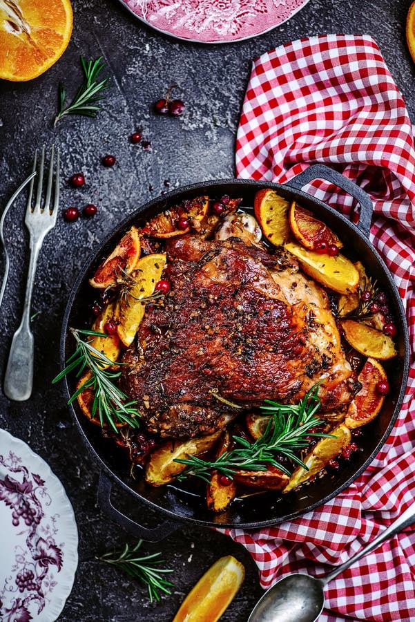 Turkey thigh baked with oranges and cranberries...style rustic.selective focus. Turkey thigh baked with oranges and cranberries...style rustic.selective focus