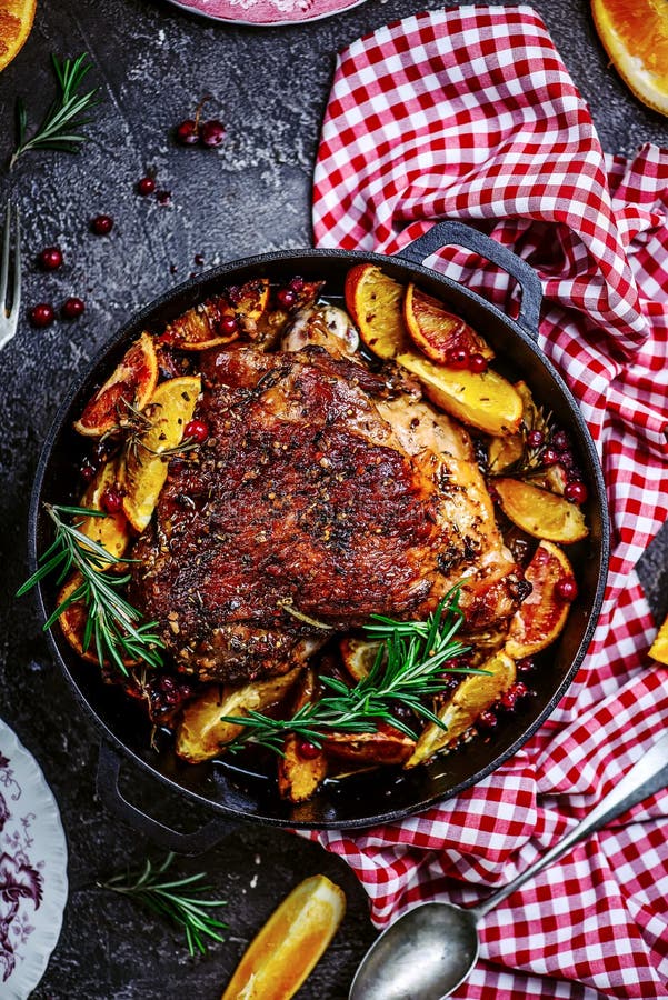 Turkey thigh baked with oranges and cranberries...style rustic.selective focus. Turkey thigh baked with oranges and cranberries...style rustic.selective focus