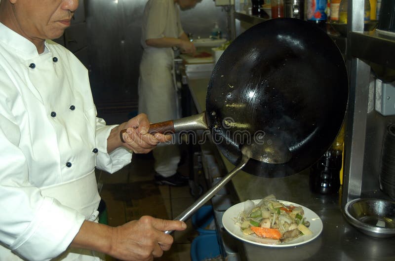 Cuisson chinoise de chef images libres de droits Cuisson chinoise de chef images libres de droits
