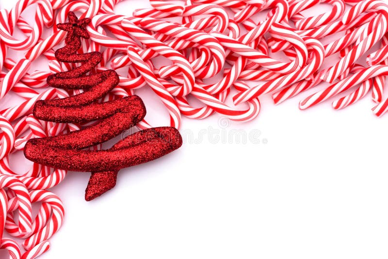 Mini candy canes making a border on a white background, Candy cane border. Mini candy canes making a border on a white background, Candy cane border