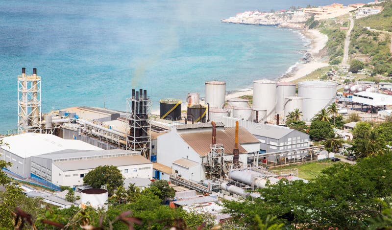 A view of bay on St Martin from hill with sugar factory on coast. A view of bay on St Martin from hill with sugar factory on coast