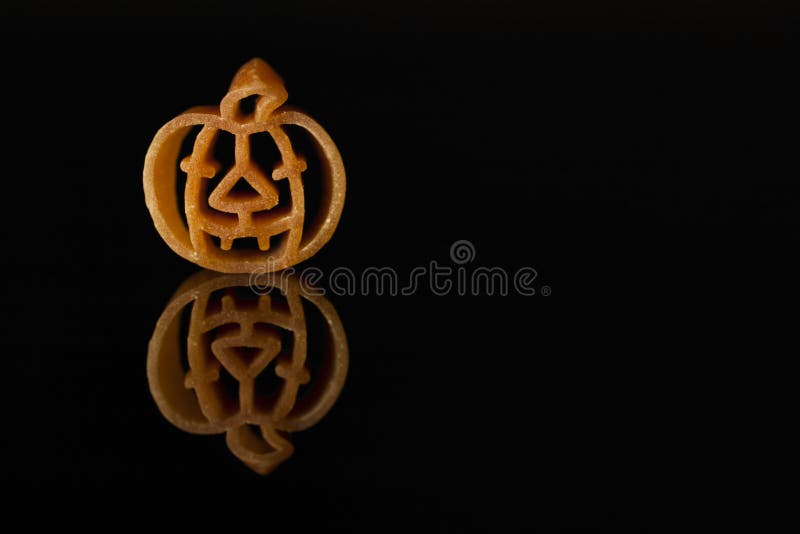 Culinary Halloween. Italian pasta shaped like an orange pumpkin. royalty free stock photography Culinary Halloween. Italian pasta shaped like an orange pumpkin. royalty free stock photography