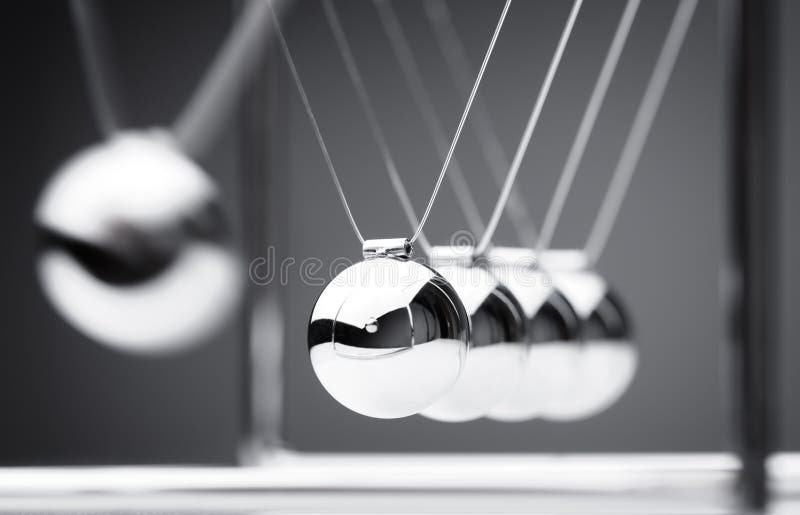 Newton's cradle physics concept for action and reaction or cause and effect. Newton's cradle physics concept for action and reaction or cause and effect
