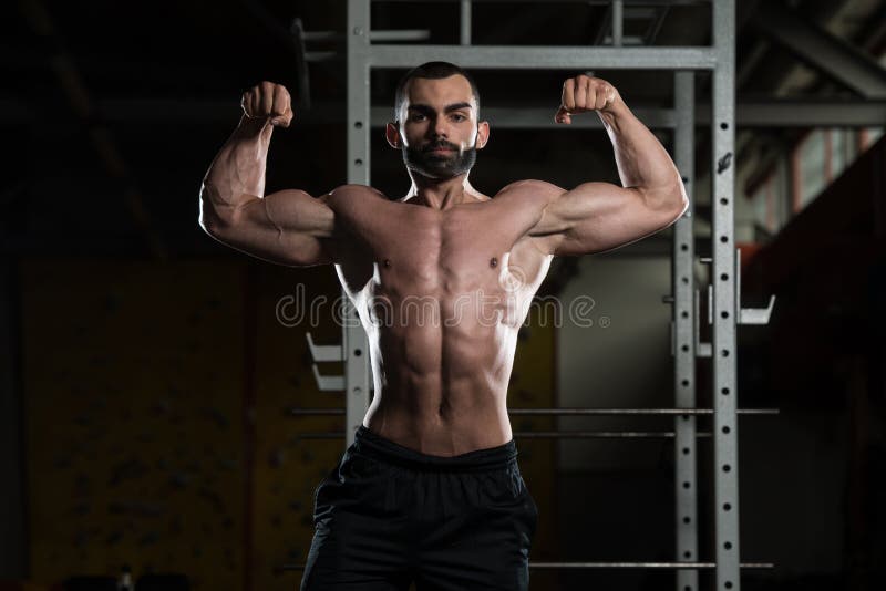 Culturista Que Dobla A Front Double Biceps Pose Imagen De Archivo Imagen De Abdominal