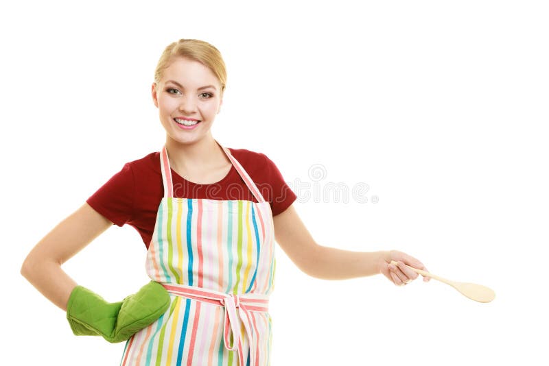 Housewife or cook chef in striped kitchen apron with wooden spoon ladle isolated studio shot. Housewife or cook chef in striped kitchen apron with wooden spoon ladle isolated studio shot