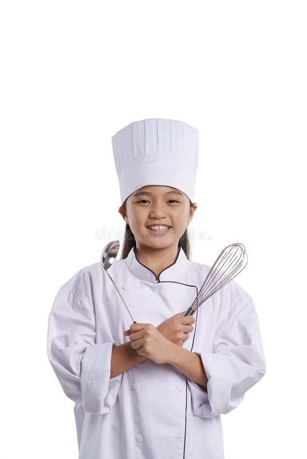 Smiling Vietnamese girl in uniform of chef, holding kitchen utensils. Smiling Vietnamese girl in uniform of chef, holding kitchen utensils