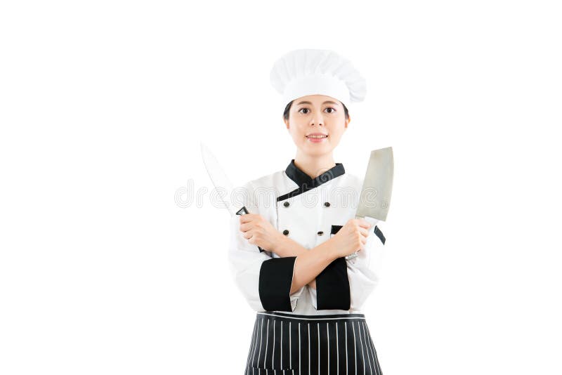 Cuoco unico professionista che mostra due coltelli taglienti immagini stock Cuoco unico professionista che mostra due coltelli taglienti immagini stock