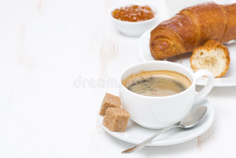 Cup of black coffee and croissants (with space for text)