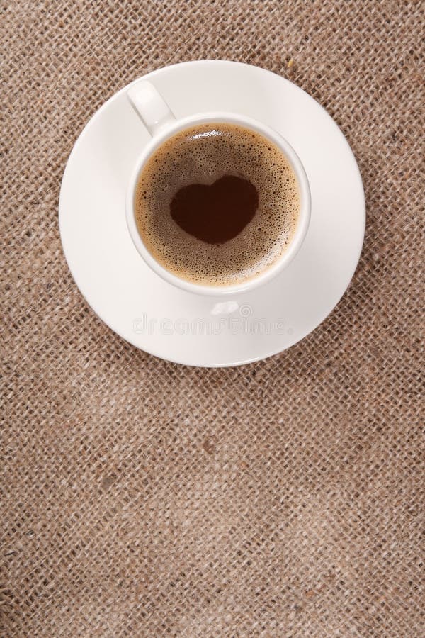 Cup of black coffee on hessian background stock photo