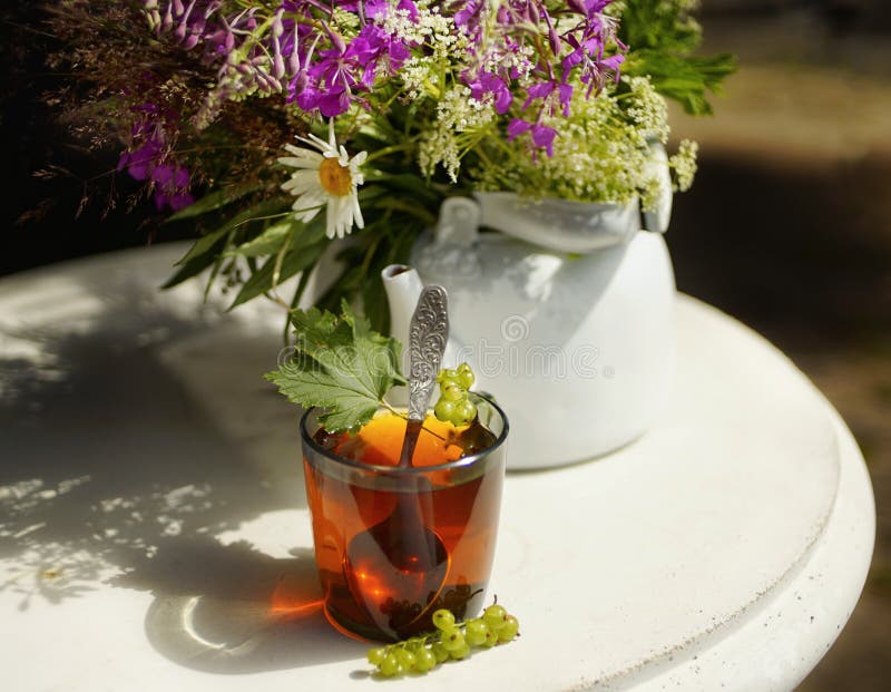 Cup Black Tea White Kettle Sunlight Table Flowers Bouquet Outdoors