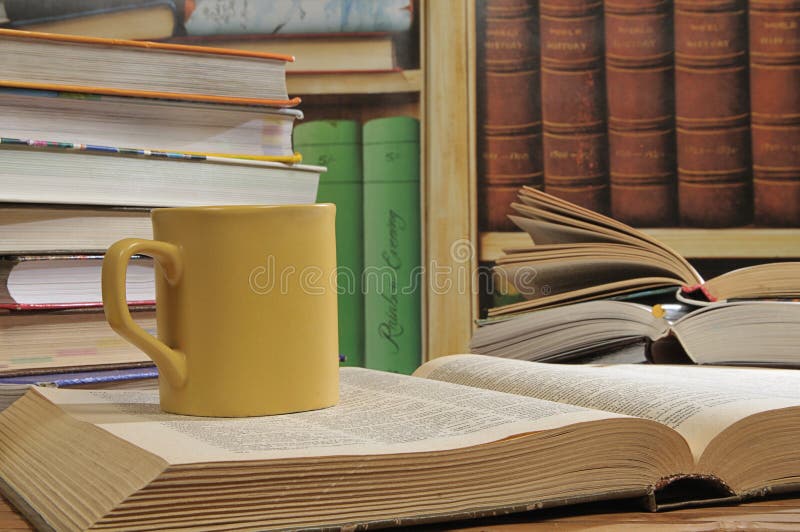 Cup and books stock photo. Image of table, coloured, 12207104