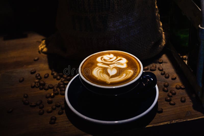 A cup of cafe latte stock photo. Image of froth, brown - 145787880