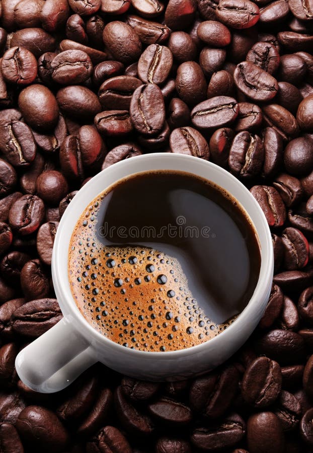 Cup of Coffee Americano Over Roasted Coffee Beans. Top View Stock Image