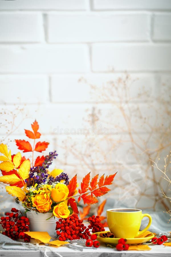Cup of coffee, autumn leaves and flowers on a wooden table. Autumn still life. Selective focus. royalty free stock photo Cup of coffee, autumn leaves and flowers on a wooden table. Autumn still life. Selective focus. royalty free stock photo