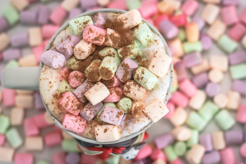 Cup of Coffee on a Background of Colored Marshmallows Stock Photo