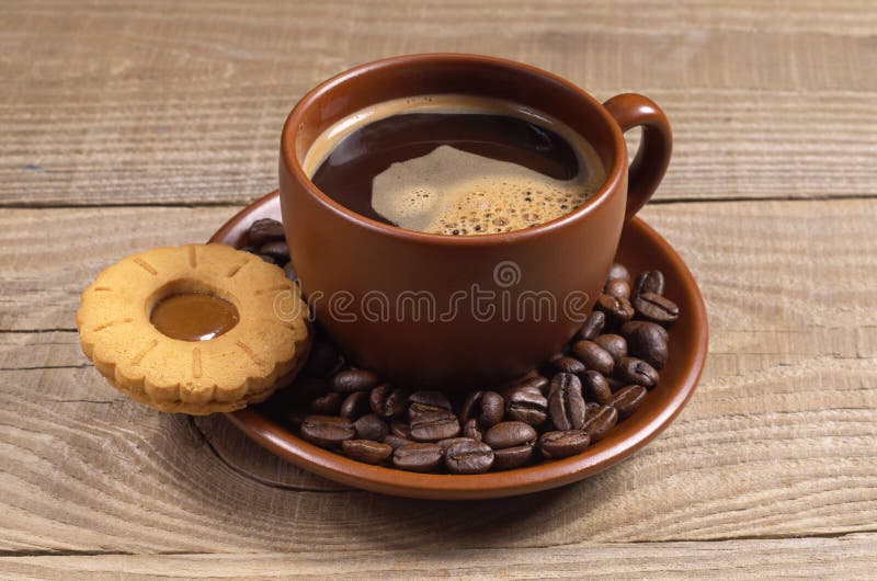 Cup of coffee with biscuit stock image. Image of beans 79240169
