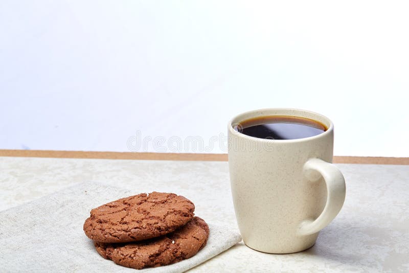 Cup of Coffee and Biscuit on the White Background, Closeup, Shallow