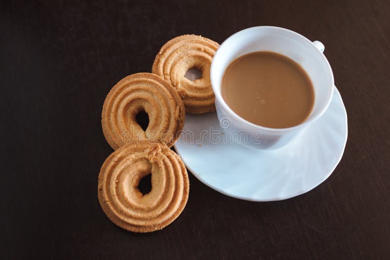 Cup of coffee and biscuits stock photo. Image of china 130050862