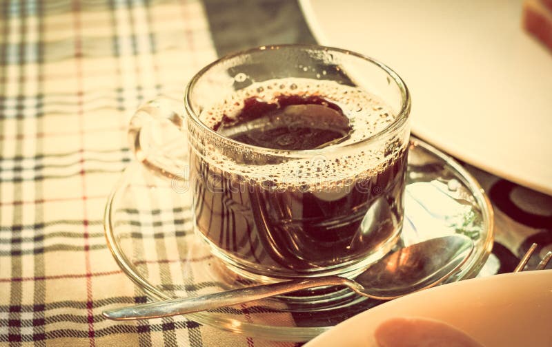 Cup of coffee with breakfast food on the table Instagram vintage