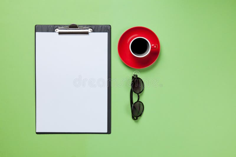 Cup of coffee and business board with glasses stock photography