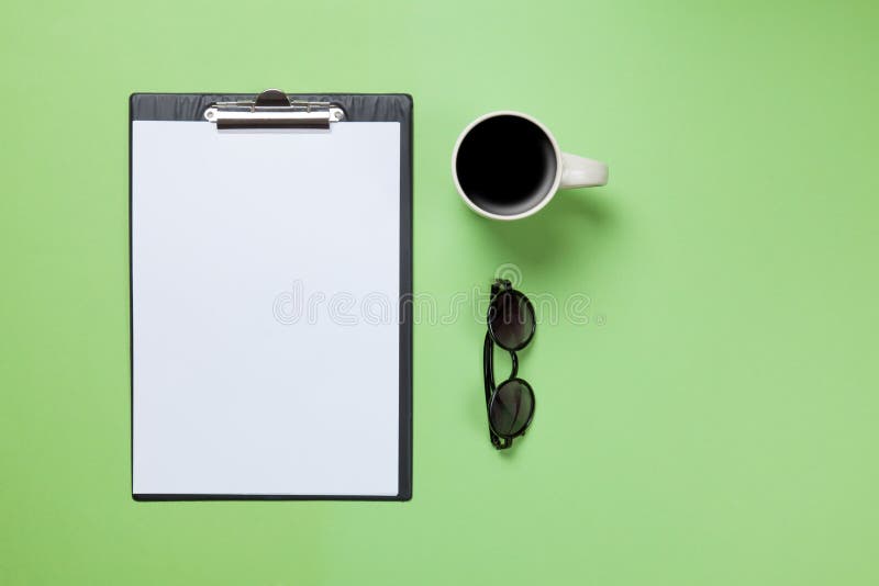 Cup of coffee and business board with glasses stock photos