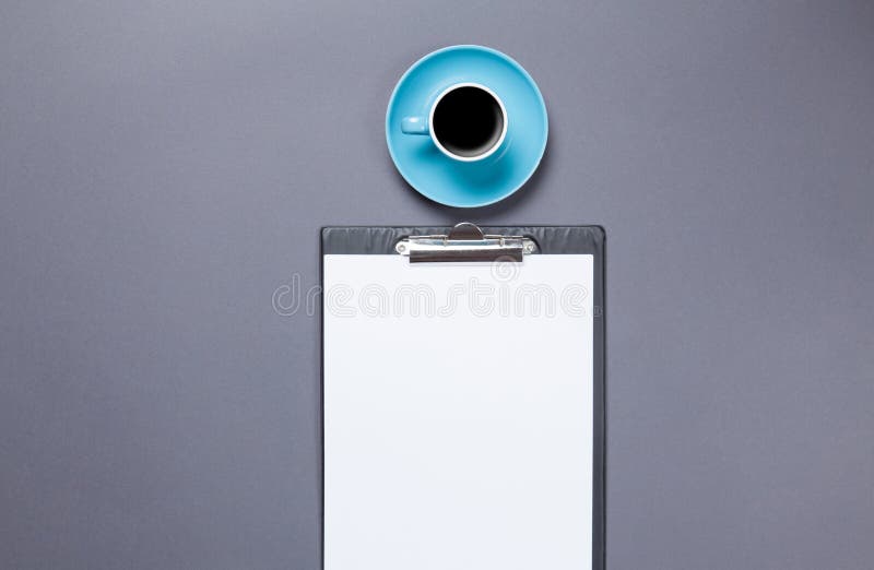 Cup of coffee and business board royalty free stock image