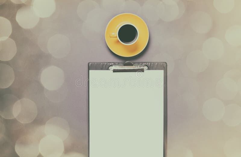 Cup of coffee and business board royalty free stock image