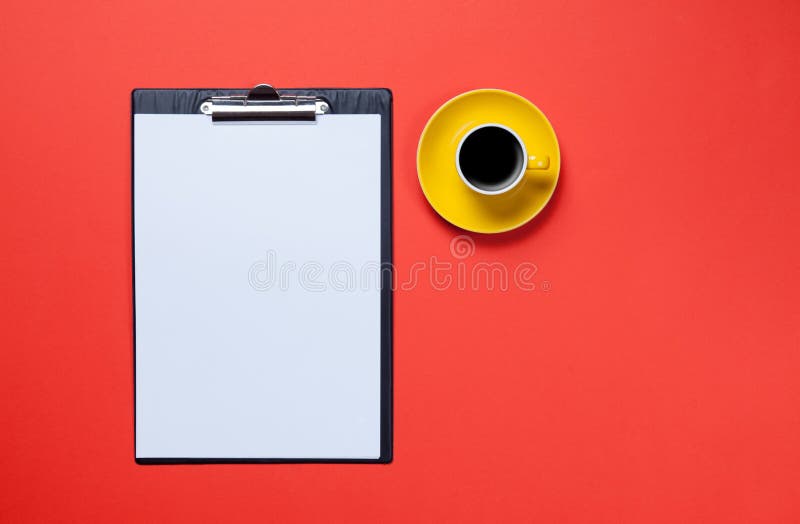 Cup of coffee and business board royalty free stock photography