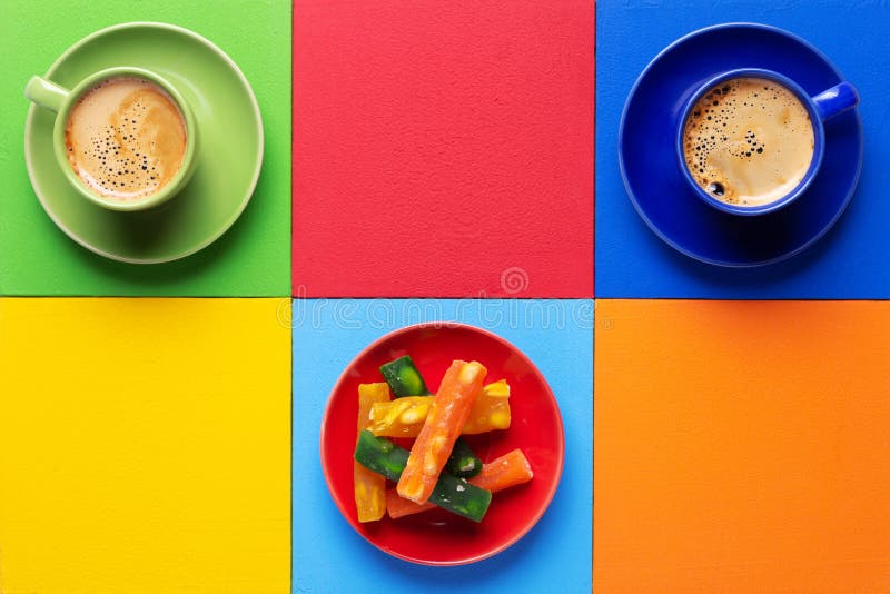 Cup of Coffee and Candied Fruit at Colorful Abstract Background Texture