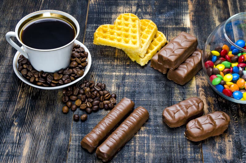 Cup of coffee with candies stock image. Image of grain 77581359