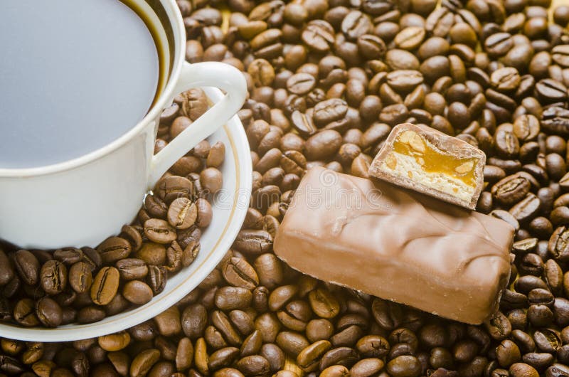 Cup of coffee with candies stock photo. Image of food 77581234