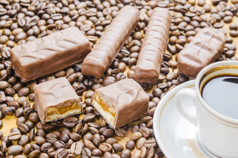 Cup of coffee with candies stock photo. Image of aroma 77580976