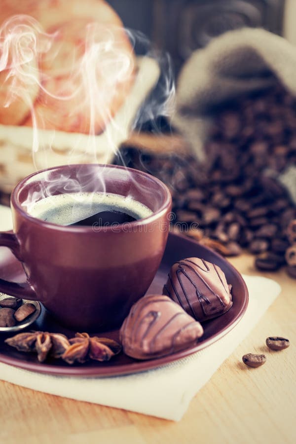 Cup coffee with chocolate candies