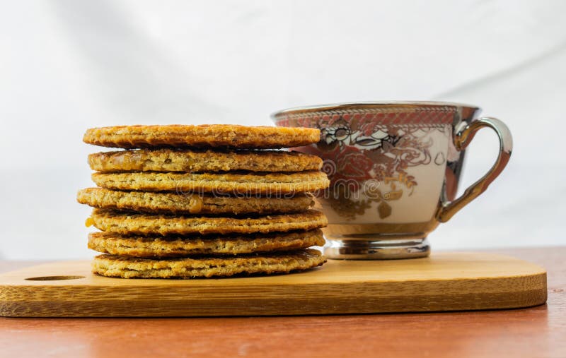 Cup of Coffee Covered with a Stroopwafel and a Group of Stroopwafels ...