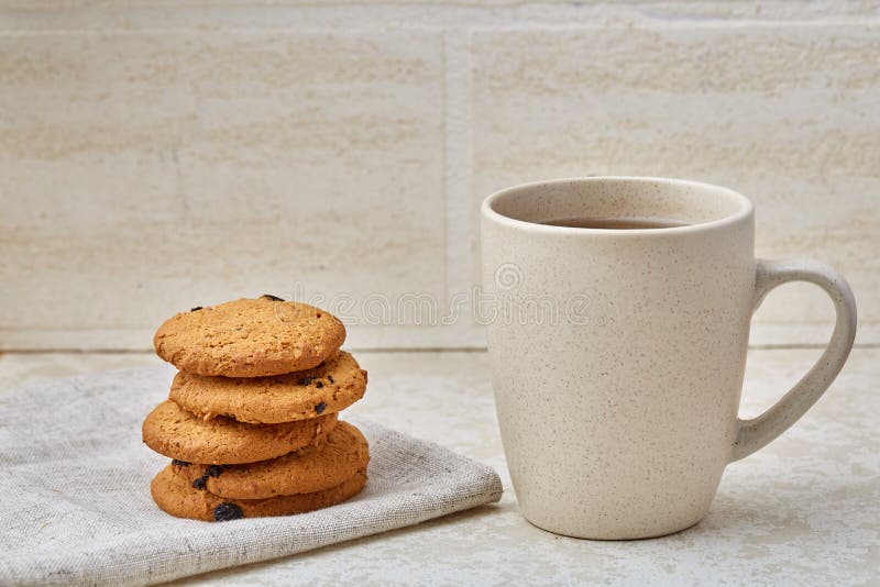 Cup of Coffee and Biscuit on the White Background, Closeup, Shallow